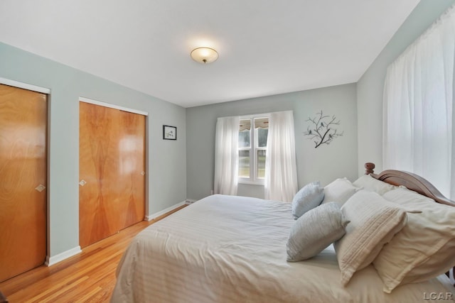 608 Brook St, Tecumseh, MI 49286 - bedroom with light wood-style flooring and baseboards