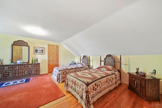 608 Brook St, Tecumseh, MI 49286 - bedroom with wood finished floors and lofted ceiling