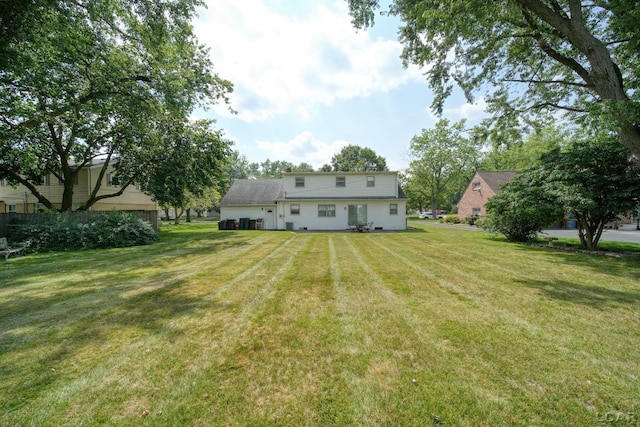 608 Brook St, Tecumseh, MI 49286 - rear view of house featuring a yard