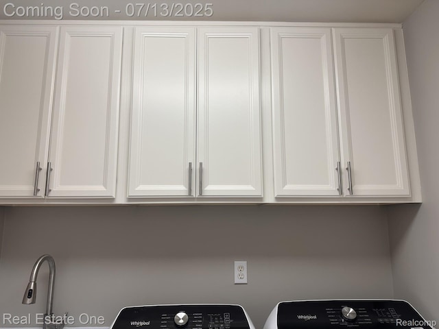 820 Woodhaven Dr, Commerce Twp, MI 48390 - laundry room featuring cabinet space and independent washer and dryer