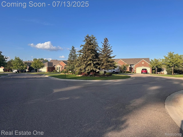 820 Woodhaven Dr, Commerce Twp, MI 48390 - view of property hidden behind natural elements featuring a residential view