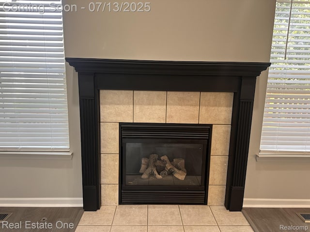 820 Woodhaven Dr, Commerce Twp, MI 48390 - detailed view of wood finished floors and a tile fireplace