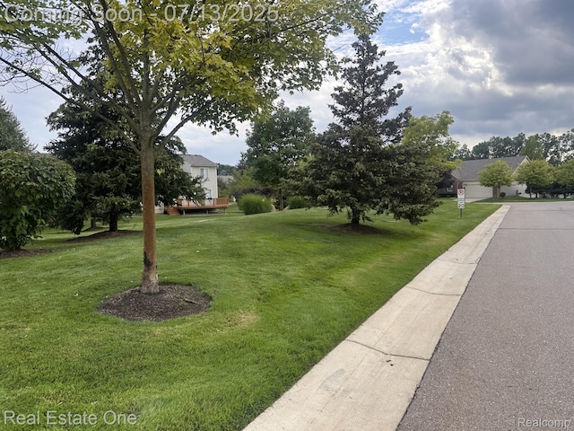 820 Woodhaven Dr, Commerce Twp, MI 48390 - view of green lawn with a deck