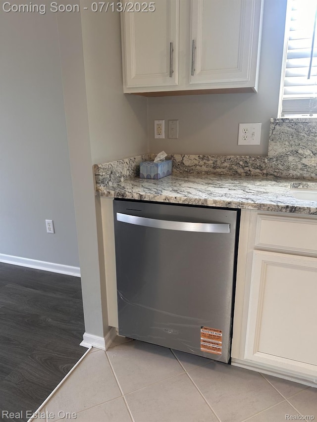 820 Woodhaven Dr, Commerce Twp, MI 48390 - detailed view of stainless steel dishwasher and baseboards