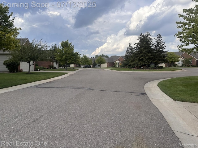 820 Woodhaven Dr, Commerce Twp, MI 48390 - view of asphalt street with a residential view