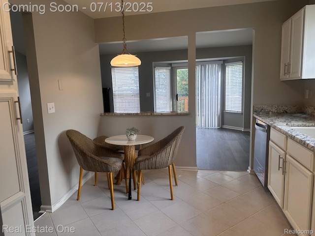 820 Woodhaven Dr, Commerce Twp, MI 48390 - dining space with baseboards and light tile patterned flooring