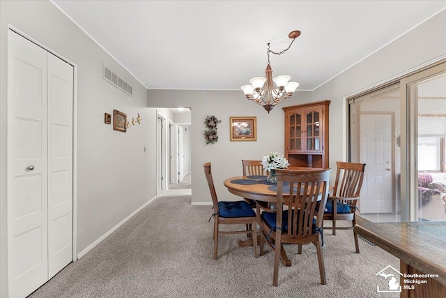 15930 Drysdale St, Southgate, MI 48195 - dining space featuring a chandelier and carpet flooring
