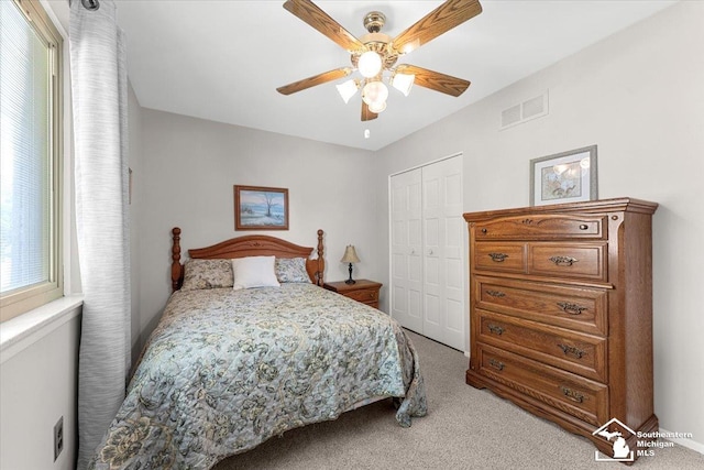 15930 Drysdale St, Southgate, MI 48195 - bedroom with light colored carpet, a closet, and a ceiling fan