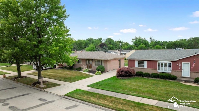 15930 Drysdale St, Southgate, MI 48195 - single story home featuring brick siding, concrete driveway, and a front lawn