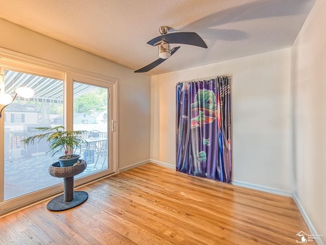1405 Arbor Ave, Monroe, MI 48162 - spare room with light wood-style floors, a ceiling fan, and a textured ceiling