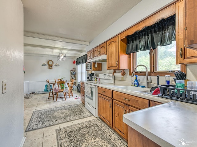 1405 Arbor Ave, Monroe, MI 48162 - kitchen with white electric stove, brown cabinets, light tile patterned floors, light countertops, and a textured ceiling