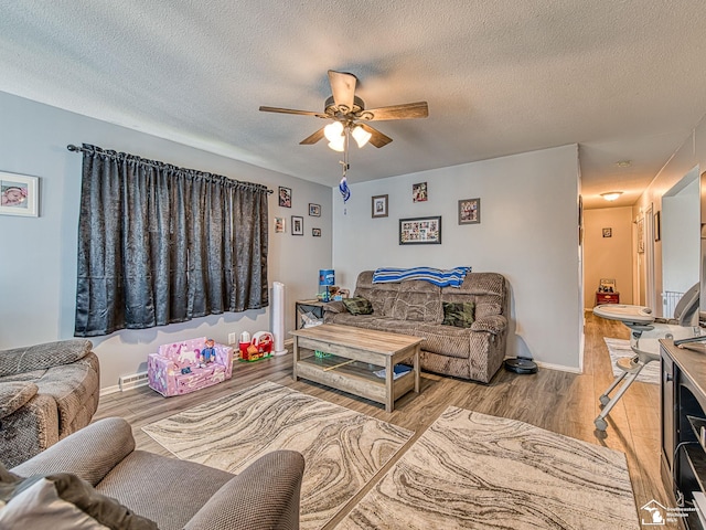 1405 Arbor Ave, Monroe, MI 48162 - living area featuring ceiling fan, a textured ceiling, and wood finished floors