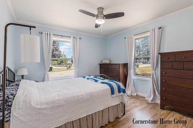 8611 Byron Center Ave SW, Byron Center, MI 49315 - bedroom with multiple windows, wood finished floors, ornamental molding, and ceiling fan