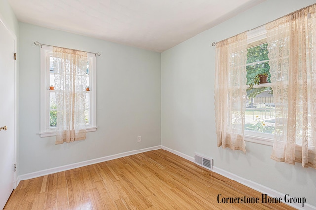 8611 Byron Center Ave SW, Byron Center, MI 49315 - spare room with wood finished floors and baseboards