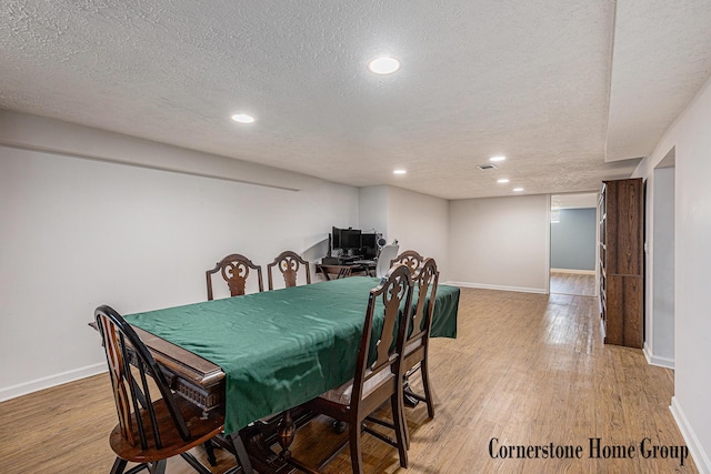 8611 Byron Center Ave SW, Byron Center, MI 49315 - dining area featuring a textured ceiling, wood finished floors, and recessed lighting