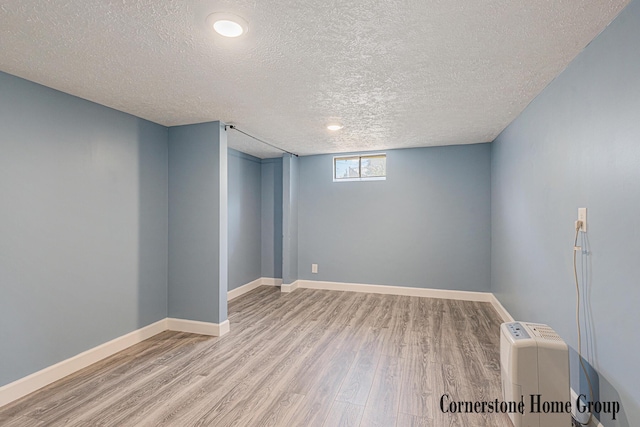 8611 Byron Center Ave SW, Byron Center, MI 49315 - basement with wood finished floors and a textured ceiling