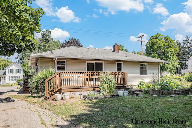 8611 Byron Center Ave SW, Byron Center, MI 49315 - rear view of property with a chimney, a lawn, a deck, and roof with shingles