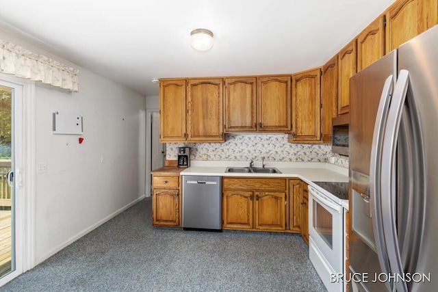 1236 S Van Bruggen Dr, Plainwell, MI 49080 - kitchen featuring appliances with stainless steel finishes, carpet, brown cabinets, and light countertops