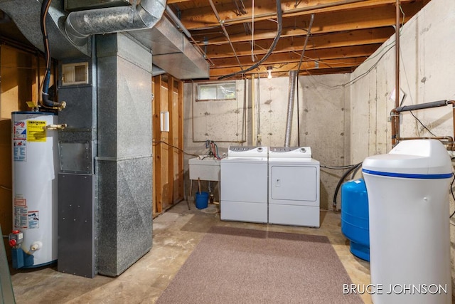 1236 S Van Bruggen Dr, Plainwell, MI 49080 - unfinished basement featuring gas water heater, a water pressure tank, separate washer and dryer, a water softener, and heating unit