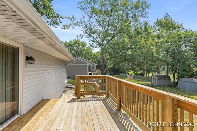 1236 S Van Bruggen Dr, Plainwell, MI 49080 - deck with a storage shed and a lawn