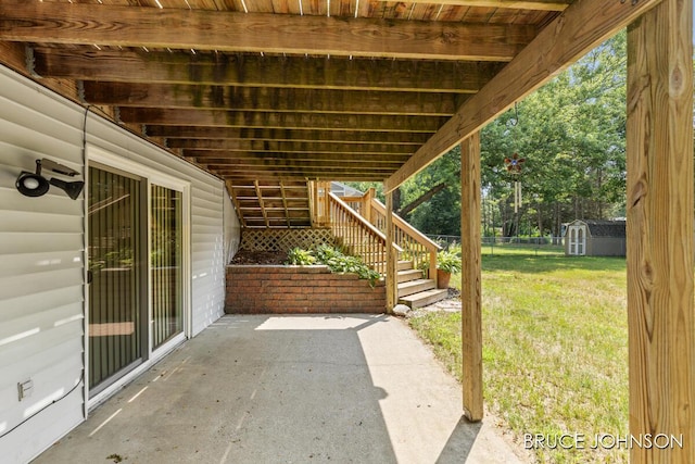 1236 S Van Bruggen Dr, Plainwell, MI 49080 - view of patio / terrace featuring a storage shed and stairs