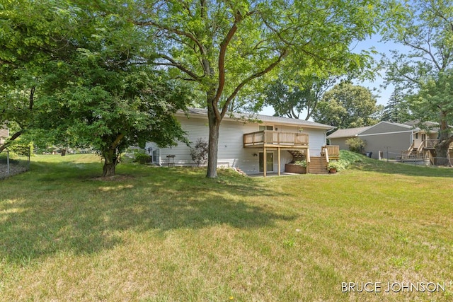 1236 S Van Bruggen Dr, Plainwell, MI 49080 - rear view of house featuring a wooden deck, a lawn, and stairway