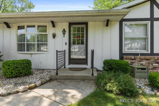 1236 S Van Bruggen Dr, Plainwell, MI 49080 - doorway to property featuring board and batten siding and covered porch