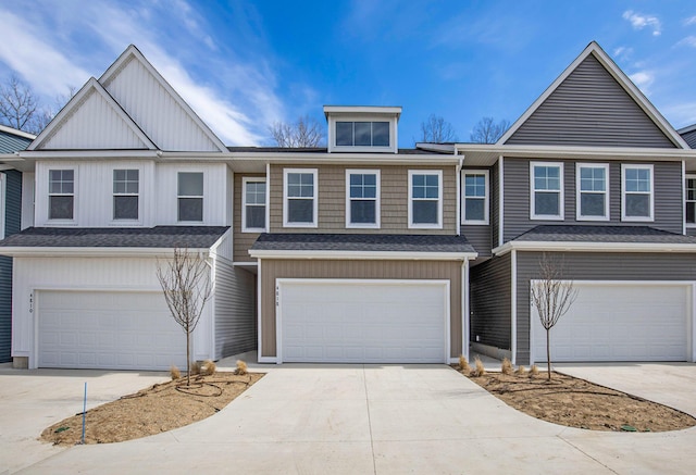 4818 Hidden River Ave SW Unit 51, Wyoming, MI 49418 - view of front of house featuring an attached garage, board and batten siding, driveway, and a shingled roof
