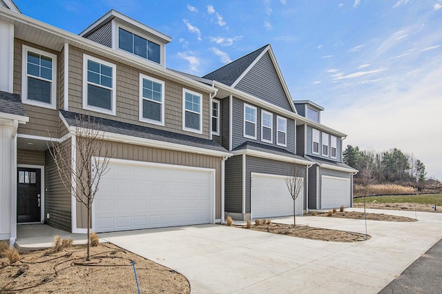 4818 Hidden River Ave SW Unit 51, Wyoming, MI 49418 - view of front of house featuring an attached garage and driveway