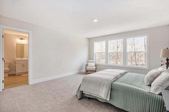 4818 Hidden River Ave SW Unit 51, Wyoming, MI 49418 - carpeted bedroom with baseboards and ensuite bath