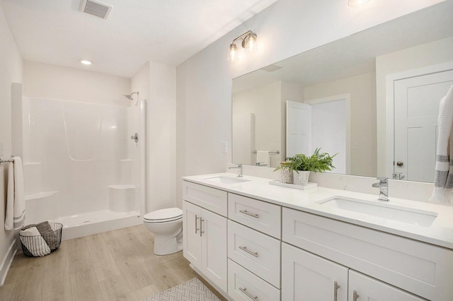 4818 Hidden River Ave SW Unit 51, Wyoming, MI 49418 - full bath featuring wood finished floors, double vanity, and walk in shower