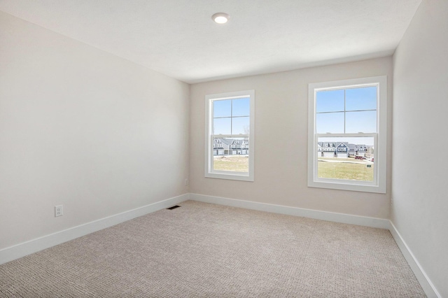 4818 Hidden River Ave SW Unit 51, Wyoming, MI 49418 - unfurnished room with light carpet and baseboards