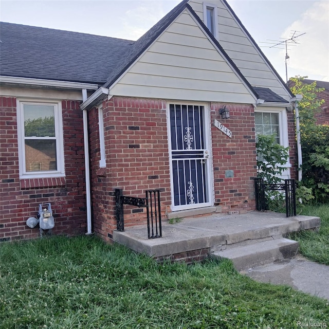 19145 Fielding St, Detroit, MI 48219 - back of house with roof with shingles and brick siding