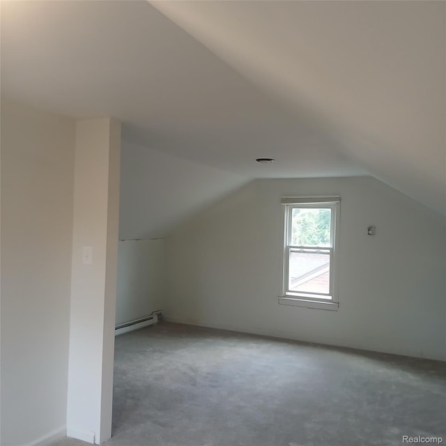 19145 Fielding St, Detroit, MI 48219 - bonus room with a baseboard heating unit, vaulted ceiling, and light carpet