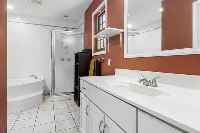16253 1st Ln, Union Pier, MI 49129 - full bathroom featuring vanity, a shower stall, a garden tub, and tile patterned floors