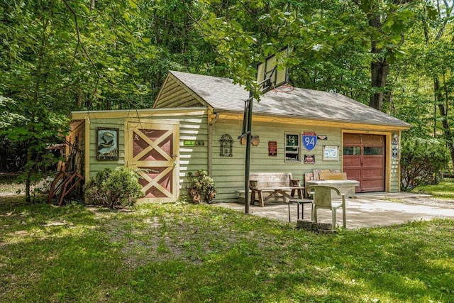 16253 1st Ln, Union Pier, MI 49129 - view of outdoor structure with concrete driveway and a garage