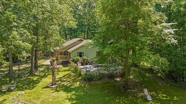 16253 1st Ln, Union Pier, MI 49129 - view of grassy yard featuring a wooden deck and a sunroom