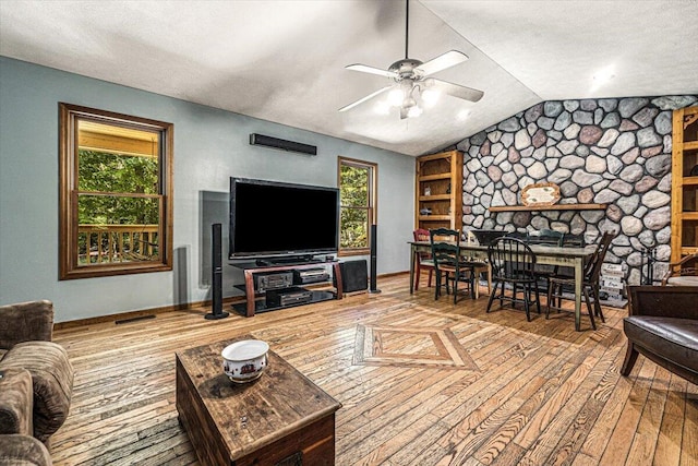 16253 1st Ln, Union Pier, MI 49129 - living room with hardwood / wood-style floors, vaulted ceiling, a ceiling fan, and a textured ceiling