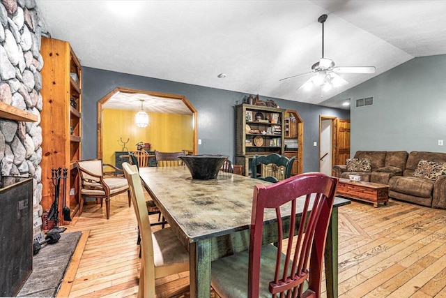 16253 1st Ln, Union Pier, MI 49129 - dining room with light wood-style flooring, arched walkways, ceiling fan, and lofted ceiling
