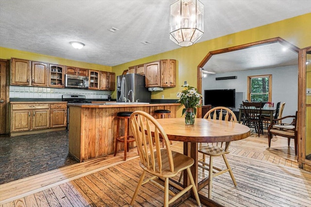 16253 1st Ln, Union Pier, MI 49129 - dining space with light wood-style floors and a textured ceiling