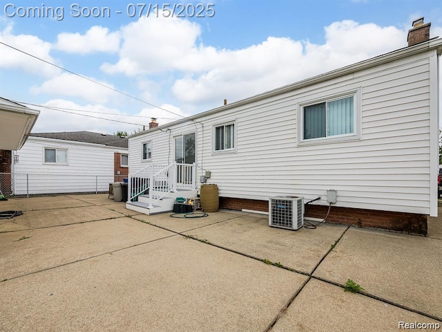 32508 Avondale St, Westland, MI 48186 - back of house with a patio area and a chimney