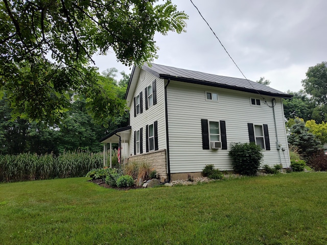 411 Block Rd, Coldwater, MI 49036 - view of side of home featuring a standing seam roof, a yard, and a metal roof