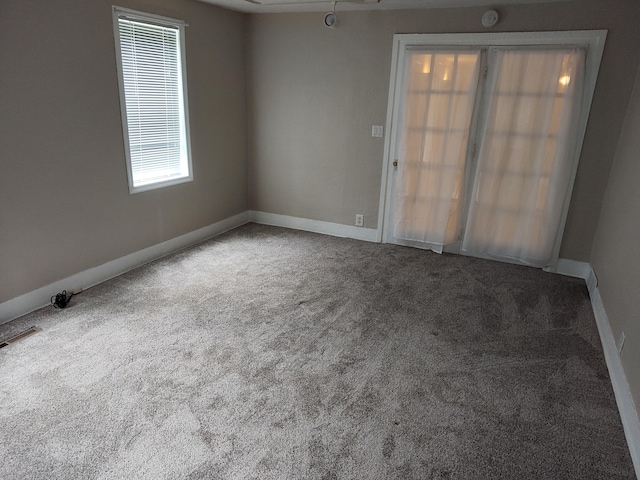 411 Block Rd, Coldwater, MI 49036 - empty room with carpet flooring, plenty of natural light, and a smoke detector