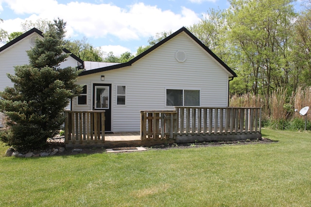 411 Block Rd, Coldwater, MI 49036 - rear view of house featuring a deck and a lawn