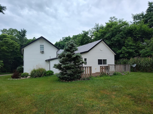 411 Block Rd, Coldwater, MI 49036 - back of property featuring a lawn and a wooden deck