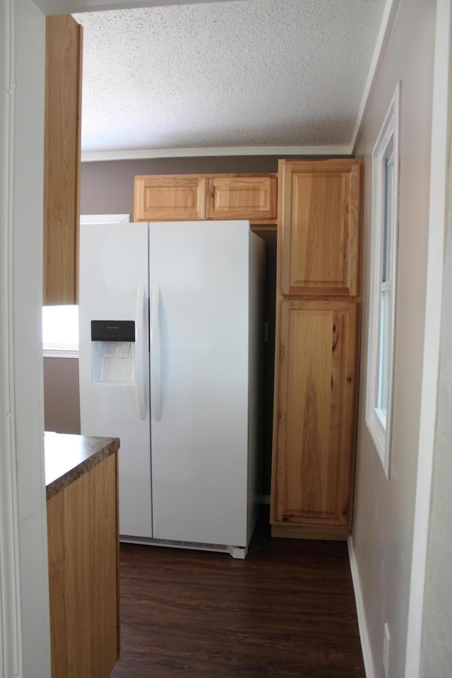 411 Block Rd, Coldwater, MI 49036 - kitchen with white refrigerator with ice dispenser, dark wood-style flooring, a textured ceiling, and light brown cabinets