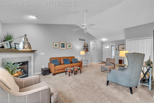 77 Sedum, Howell, MI 48843 - living area with carpet, a ceiling fan, lofted ceiling, and a high end fireplace