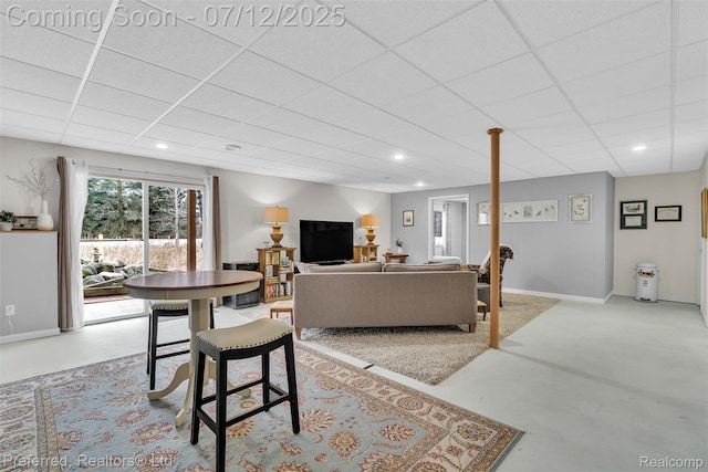 77 Sedum, Howell, MI 48843 - living area with finished concrete floors, a paneled ceiling, and recessed lighting