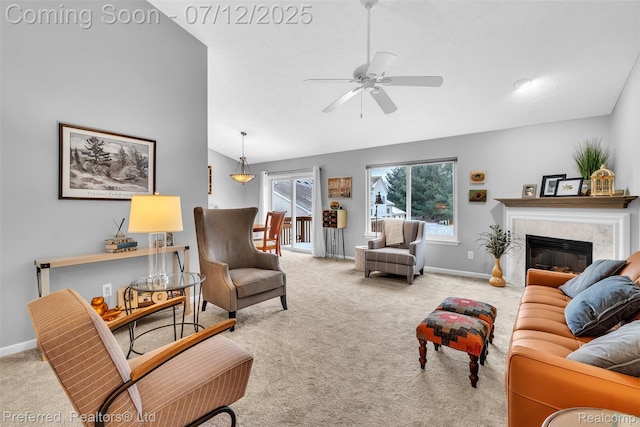 77 Sedum, Howell, MI 48843 - carpeted living area with vaulted ceiling, a fireplace, and ceiling fan