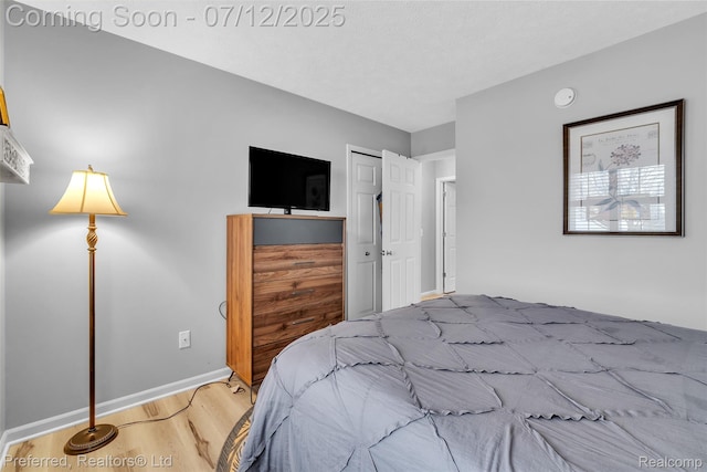 77 Sedum, Howell, MI 48843 - bedroom featuring wood finished floors and a closet